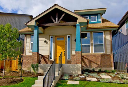 Craftsman home with yellow door in Crestview, Central Austin